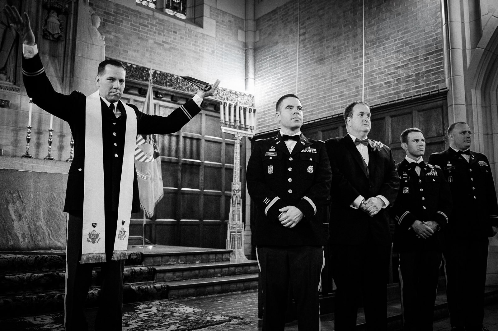 Military chaplain blessing captured in black and white during a New Jersey chapel wedding ceremony