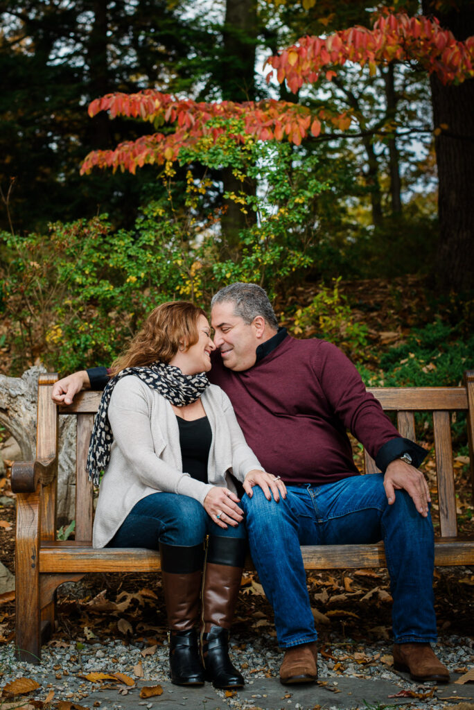 Intimate bench moment during a fall engagement session at Overpeck County Park Bergen County NJ