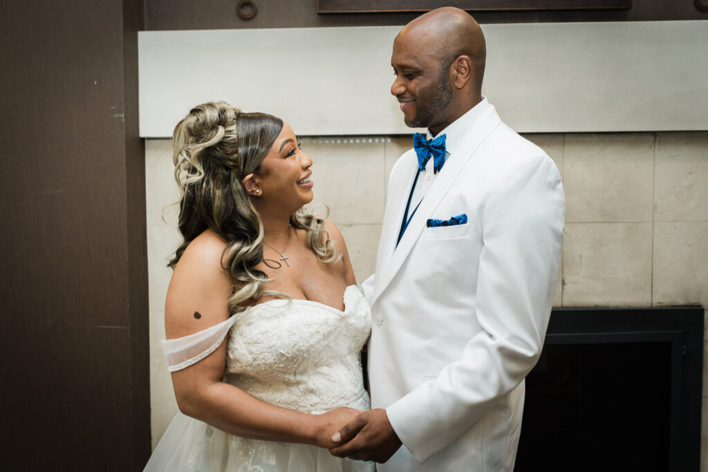 Bride and groom smiling and looking at each other during close couple portrait at Sheraton Parsippany Hotel NJ