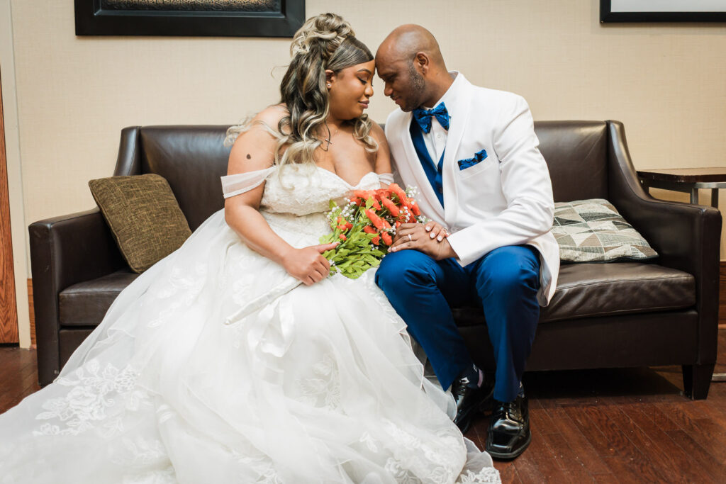 Bride and groom touching foreheads in quiet intimate portrait at Sheraton Parsippany Hotel NJ wedding