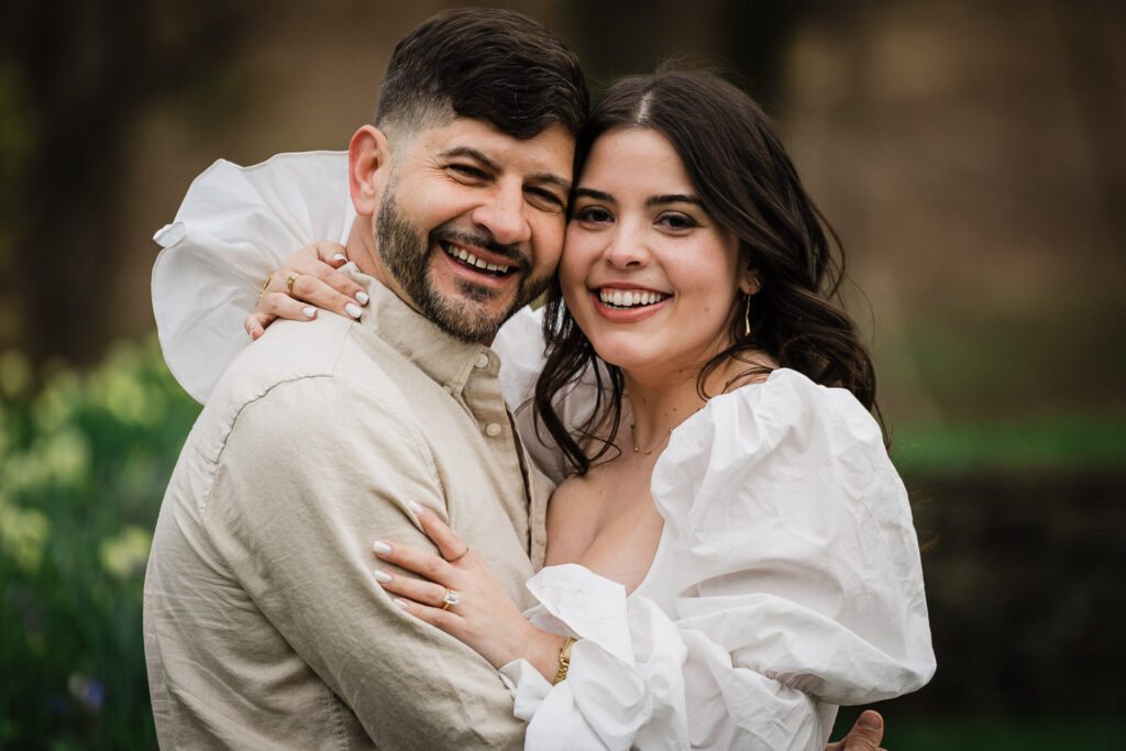 Couple positioned toward the camera during a garden proposal at Deep Cut Gardens in NJ