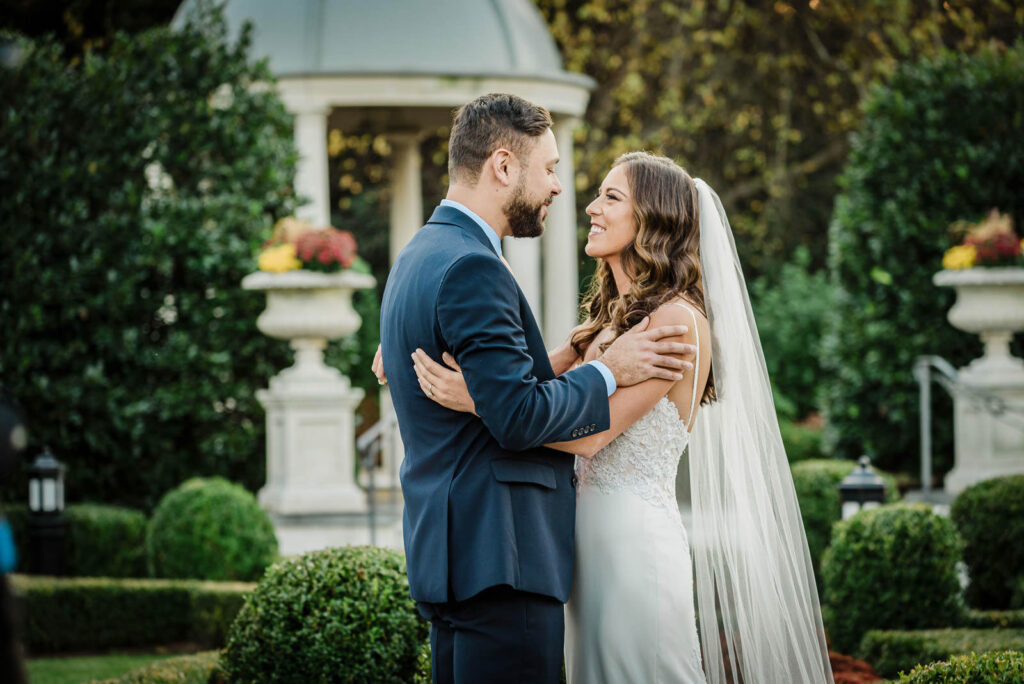 Couple smiling at each other during their New Jersey wedding ceremony