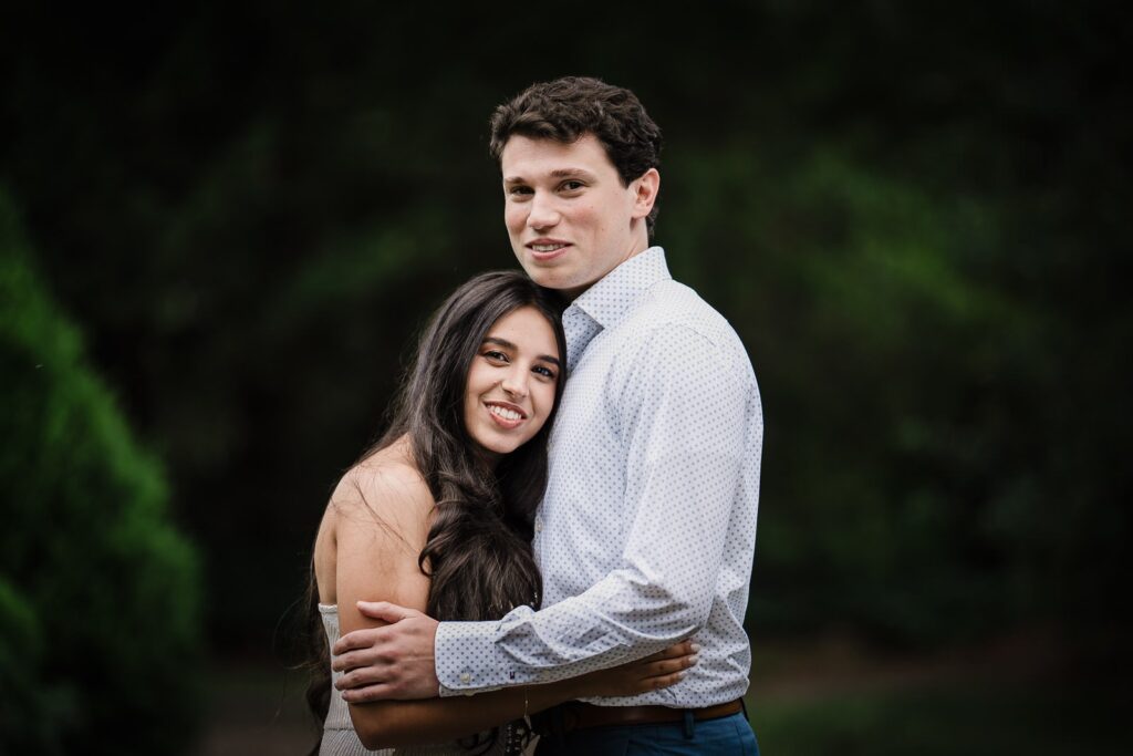 Newly engaged couple embracing after a surprise proposal at Van Vleck House Montclair NJ