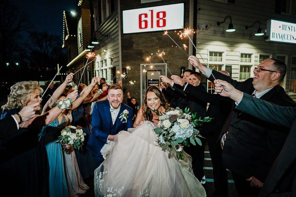 Newlyweds exiting through a sparkler send-off at 618 Restaurant in Freehold NJ