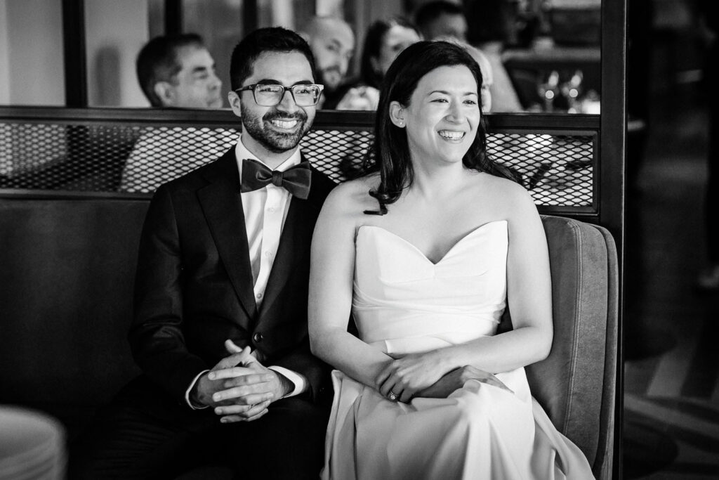 Bride and groom sharing a quiet, candid moment in black and white at their NYC wedding
