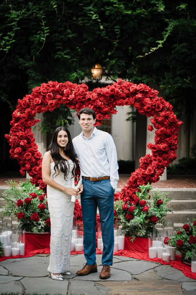 Wide view of a custom floral proposal setup with red carpet at Van Vleck House NJ