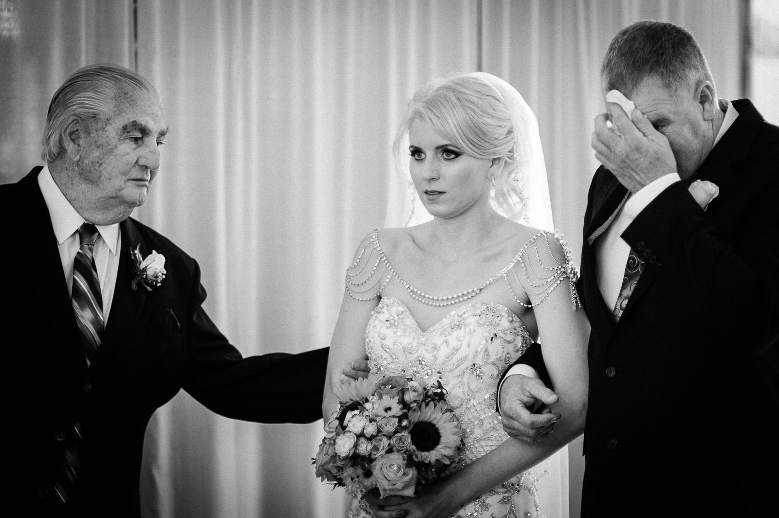 Father and grandfather steadying the bride before her New Jersey wedding ceremony