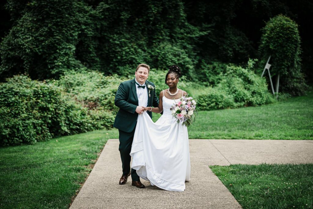 Antonio and Nadjah walking through the gardens at Abington Art Center