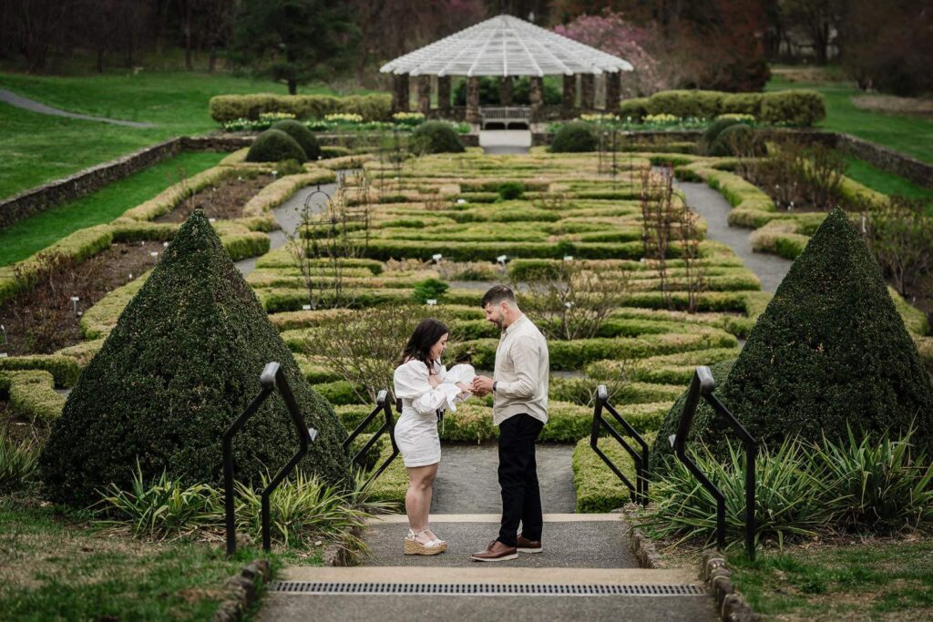 Couple alone on the parterre steps at Deep Cut Gardens under soft even garden light