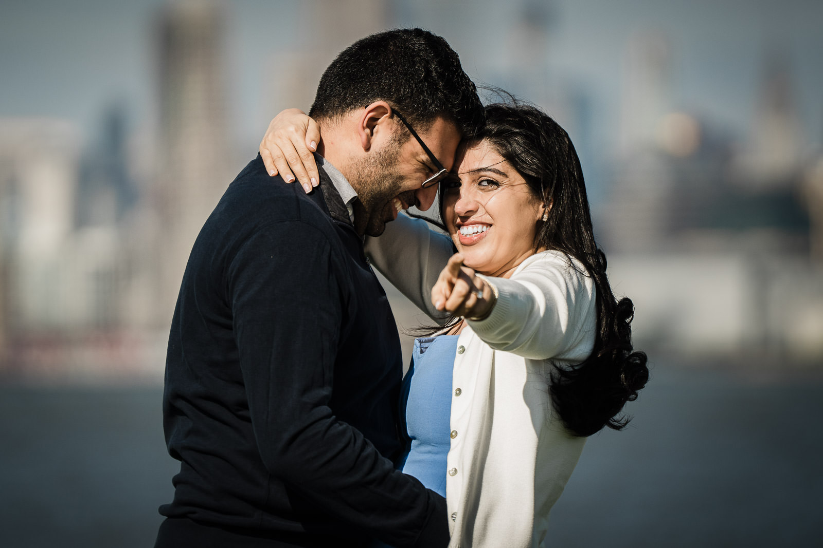 Newly engaged couple taking photos at Liberty State Park after their surprise proposal