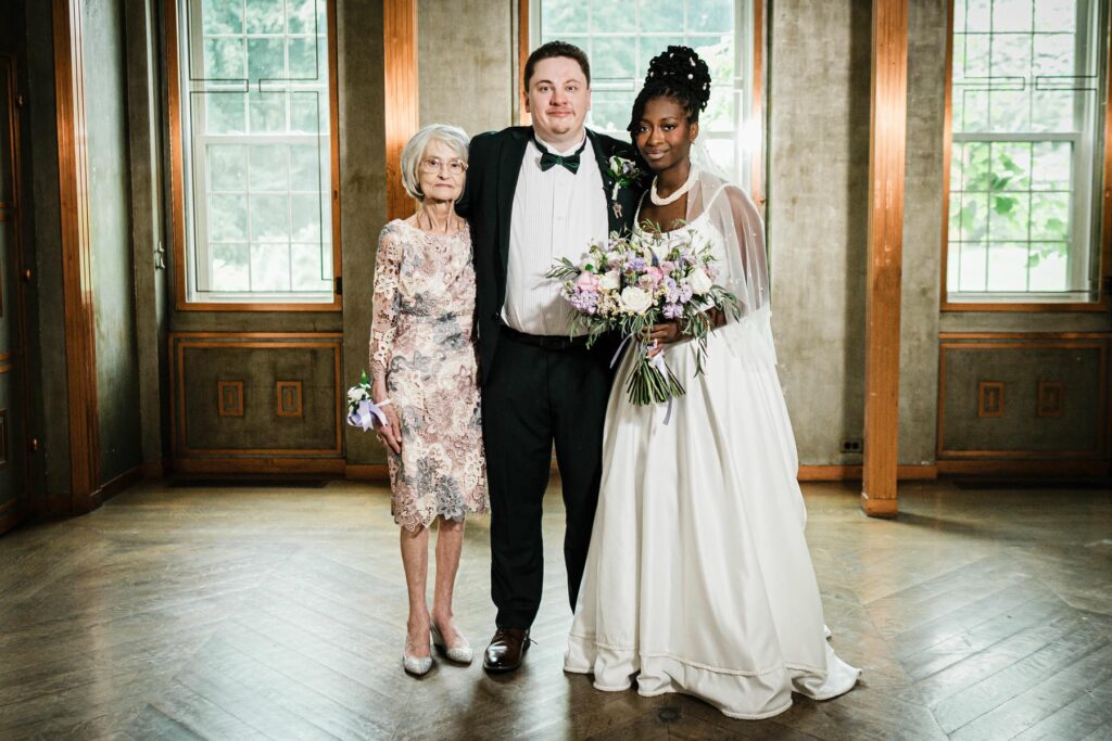 Family portrait with the bride and groom inside Alverthorpe Manor