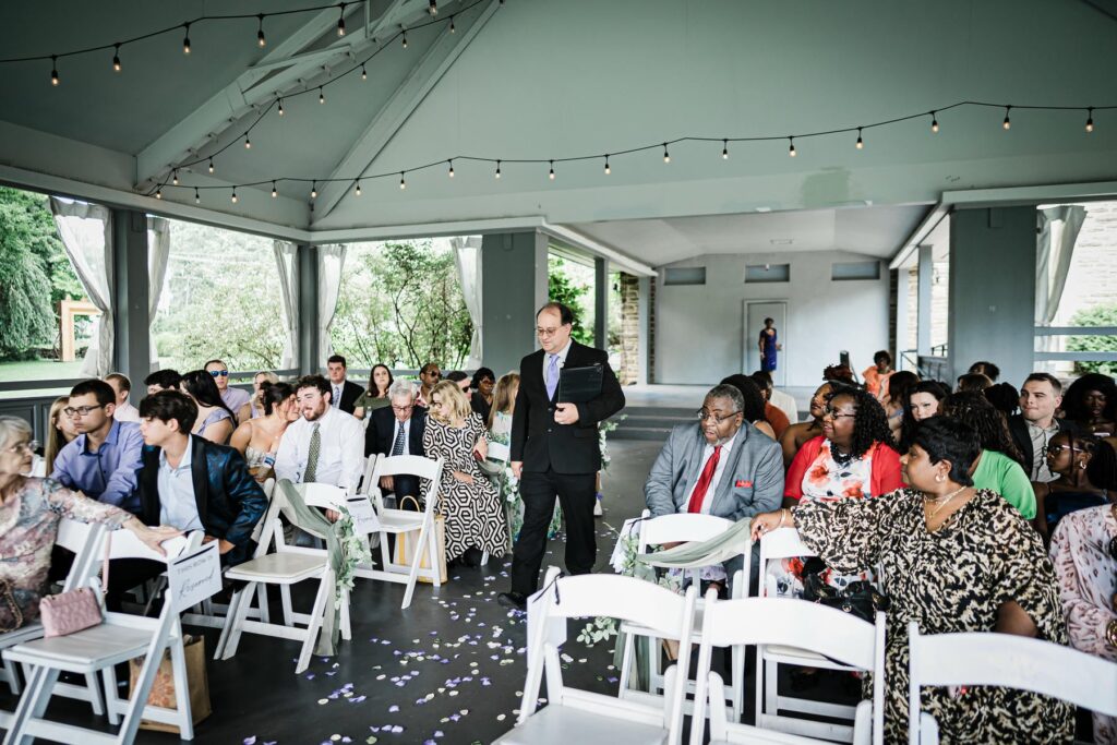 Guests seated for an intimate wedding ceremony at Abington Art Center