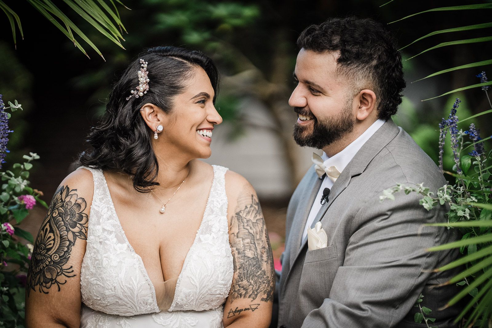 Bride and groom laughing together during outdoor couple portraits at a New Jersey wedding