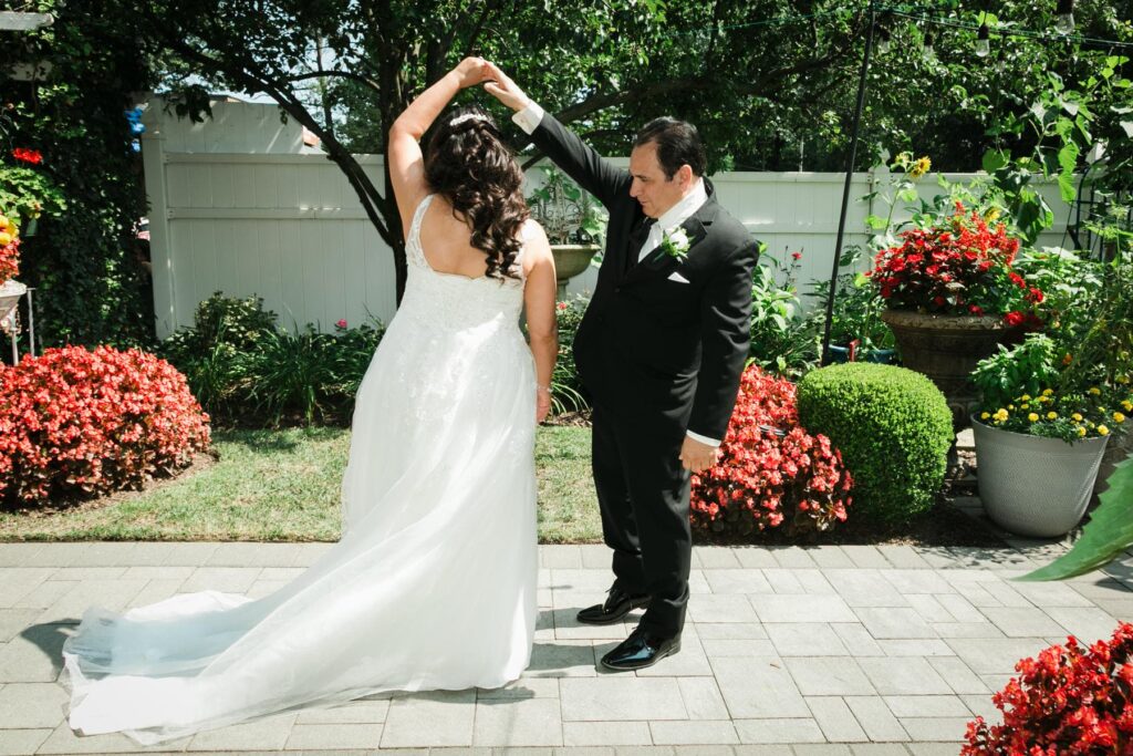Bride and groom during their first look in the Piazza di Roma gardens