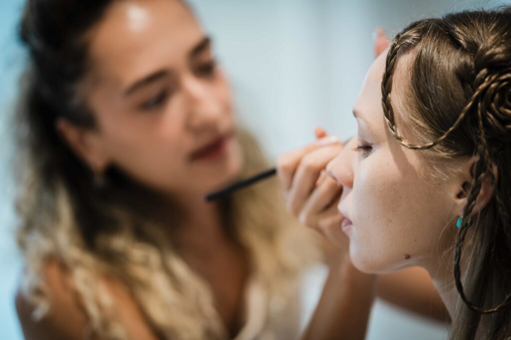 Bride having her makeup applied in the getting ready suite at The Mill Lakeside Manor