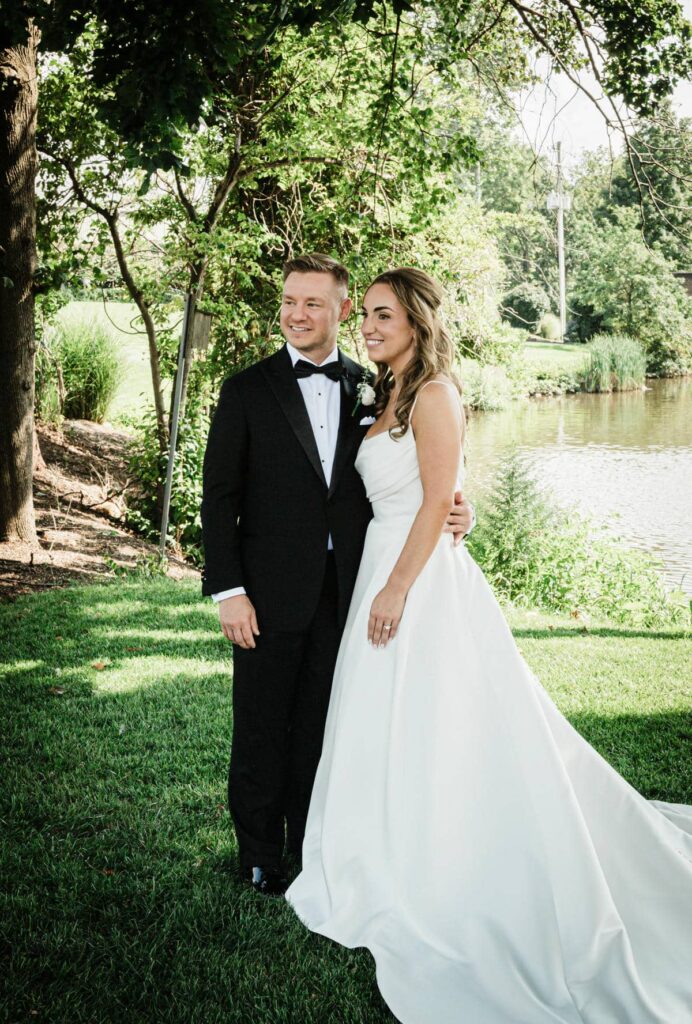 Bridal portrait beneath a mature tree on the grounds at Brooklake Country Club