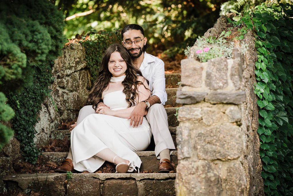 Close up save the date engagement photo idea of a couple on stone garden steps
