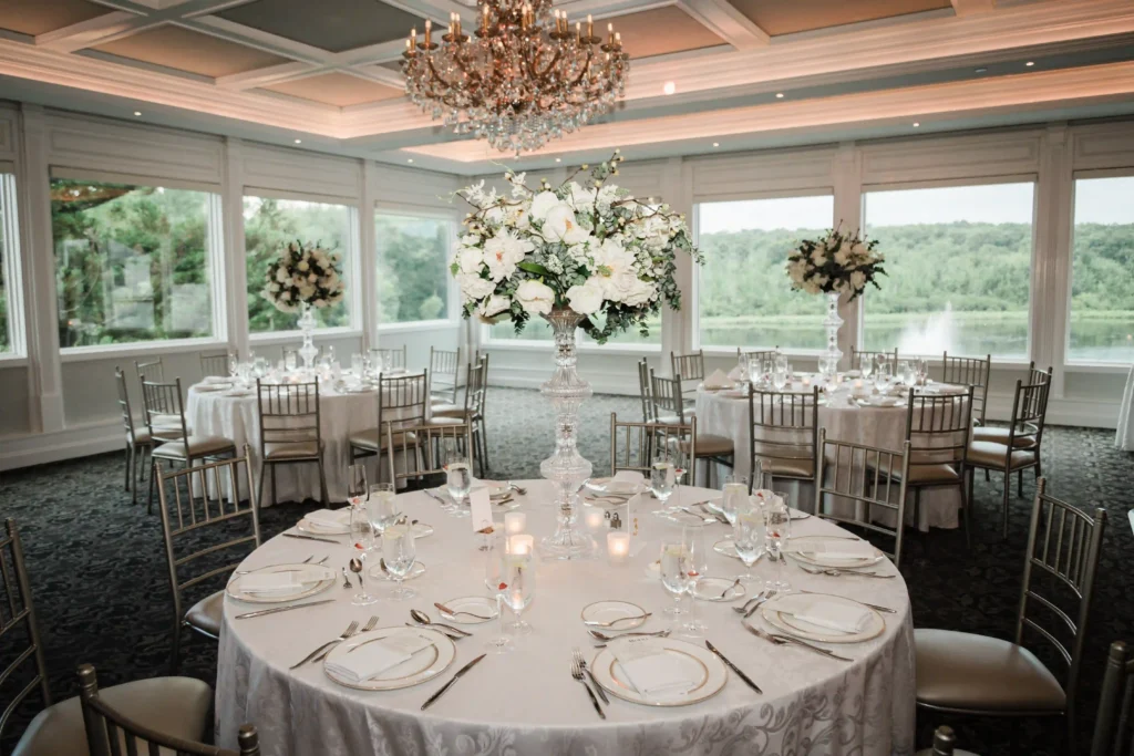 Ballroom set for the wedding reception overlooking the lake at The Mill Lakeside Manor