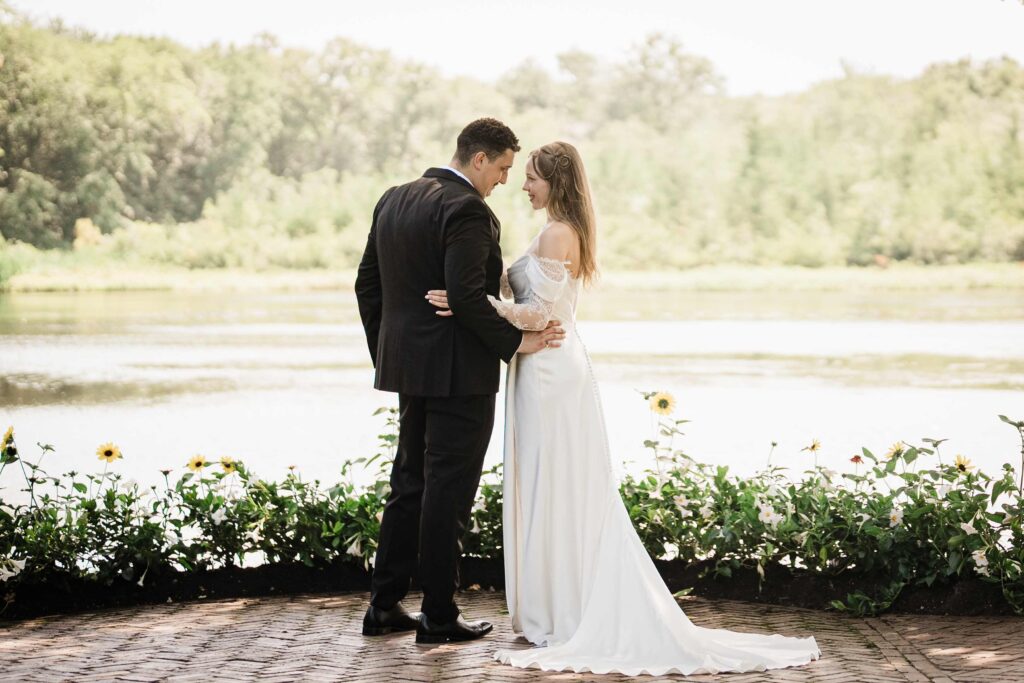 couple rear shot in front of lake manor in nj