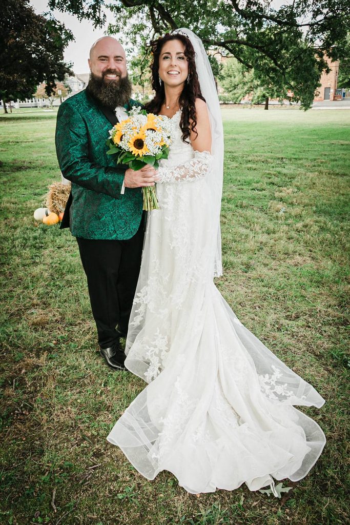 Bride and groom pose for a full-length portrait at Collingswood Grand Ballroom