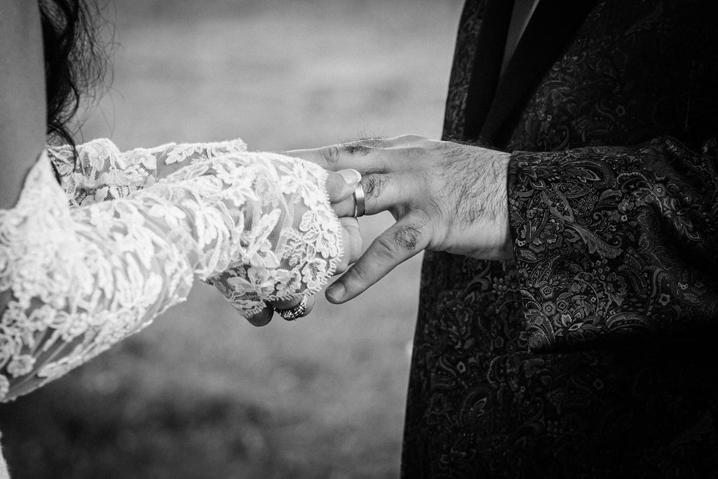 Close-up of the couple's joined hands during their outdoor Collingswood wedding ceremony