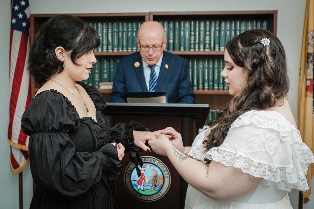 Couple exchanges rings during their ceremony at a Hackensack NJ courthouse