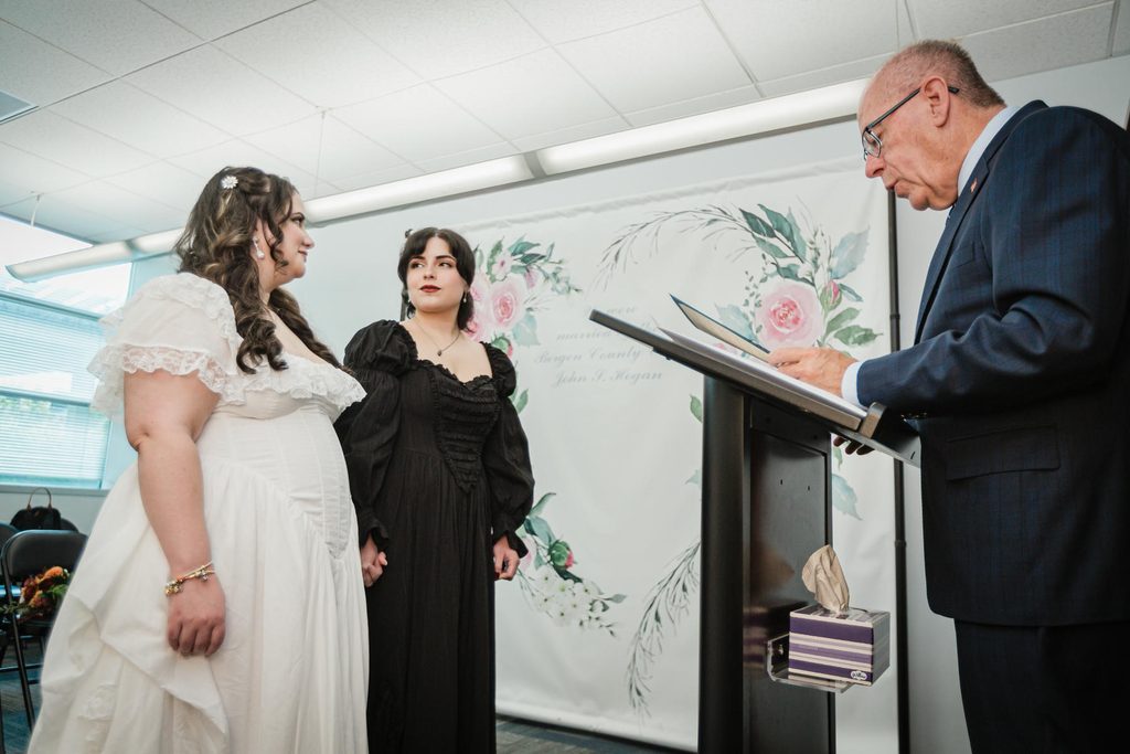 Couple stands at the podium during their vows at a Hackensack NJ courthouse wedding