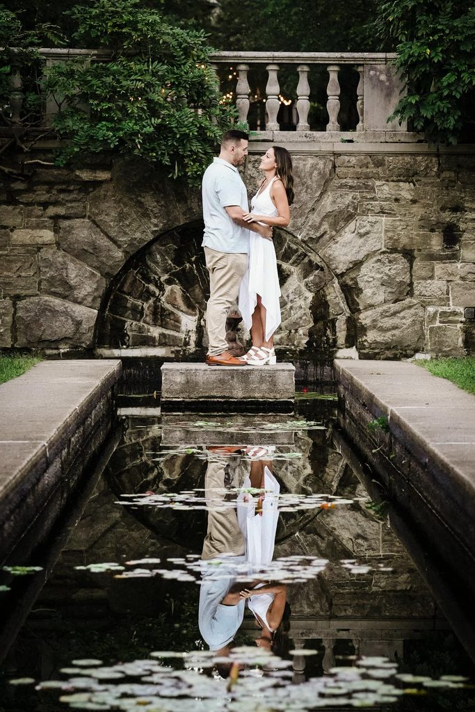 Jonathan and Emma standing at the reflecting pool at Skylands Manor in New Jersey