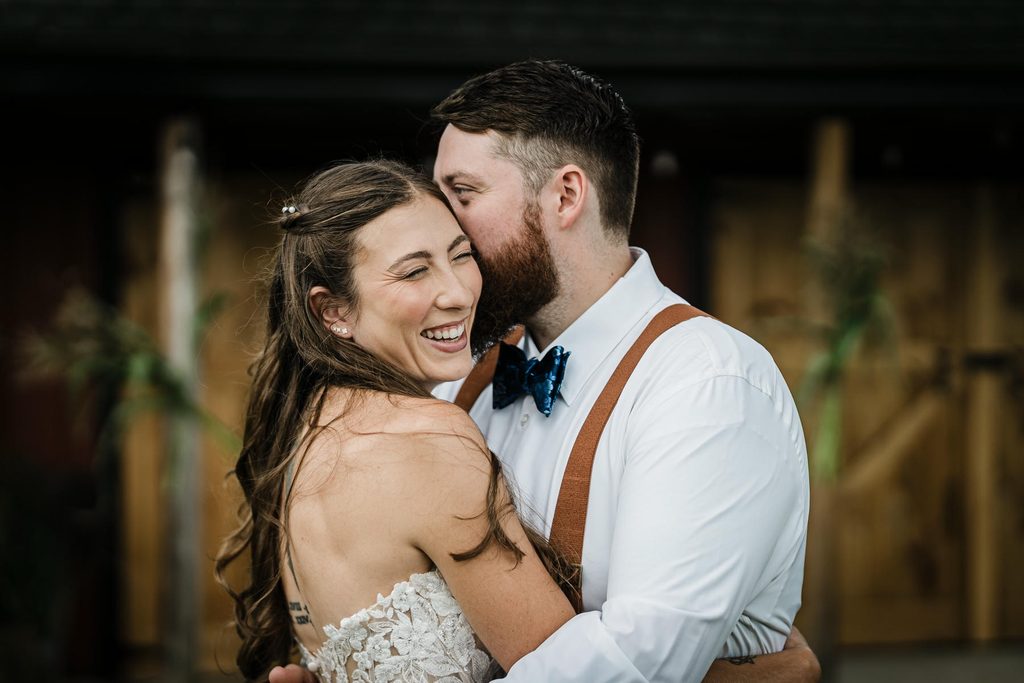 Smiling bride and groom portrait on the lawn at their Franklin Township backyard wedding
