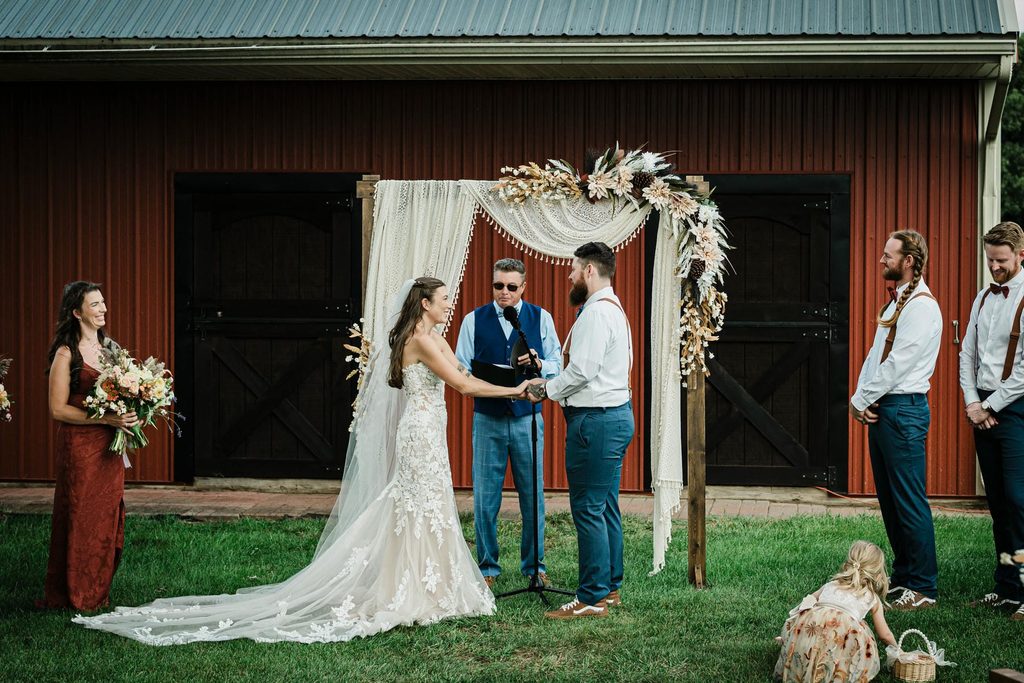 Guests and wedding party at an outdoor ceremony on the lawn in Franklin Township
