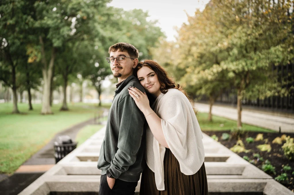 Engaged couple embracing outside Bell Works in Holmdel after their indoor photo session